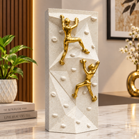Anupam Premium Golden Rock Climbing Couple Showpiece with White Textured Base | Motivational Home & Office Decor