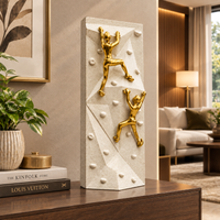 Anupam Premium Golden Rock Climbing Couple Showpiece with White Textured Base | Motivational Home & Office Decor