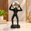 Anupam modern Atlas man holding silver sphere figurine lifestyle view