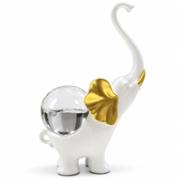 Anupam white and gold elephant figurine on white background