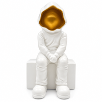 Anupam white and gold seated figurine features