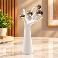Anupam white abstract hand figurine with metallic silver spheres premium decor