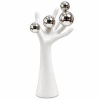 Anupam white abstract hand figurine with silver spheres on white background