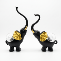 Anupam black gold elephant figurine set white background
